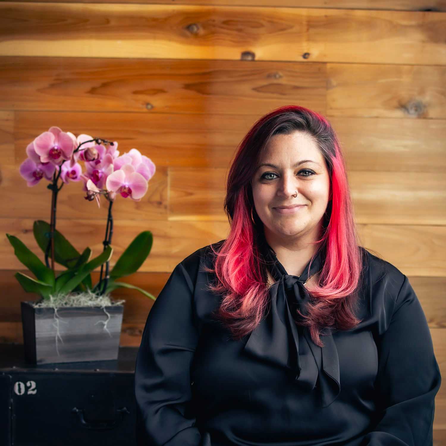 Portrait of Danamarie, a professional stylist at Salon Paul Michael, showcasing their expertise and style.