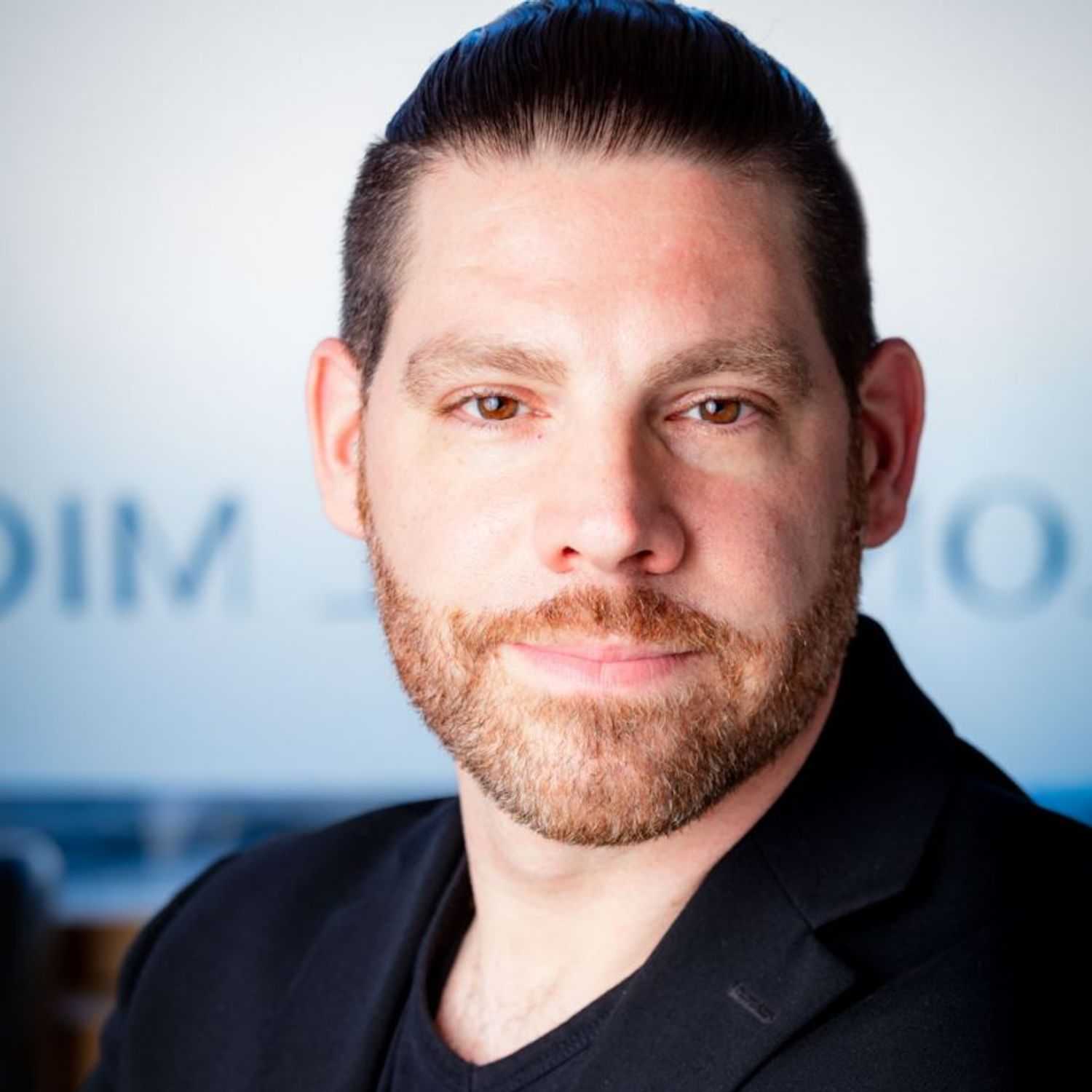 Portrait of Paul, a professional stylist at Salon Paul Michael, showcasing their expertise and style.