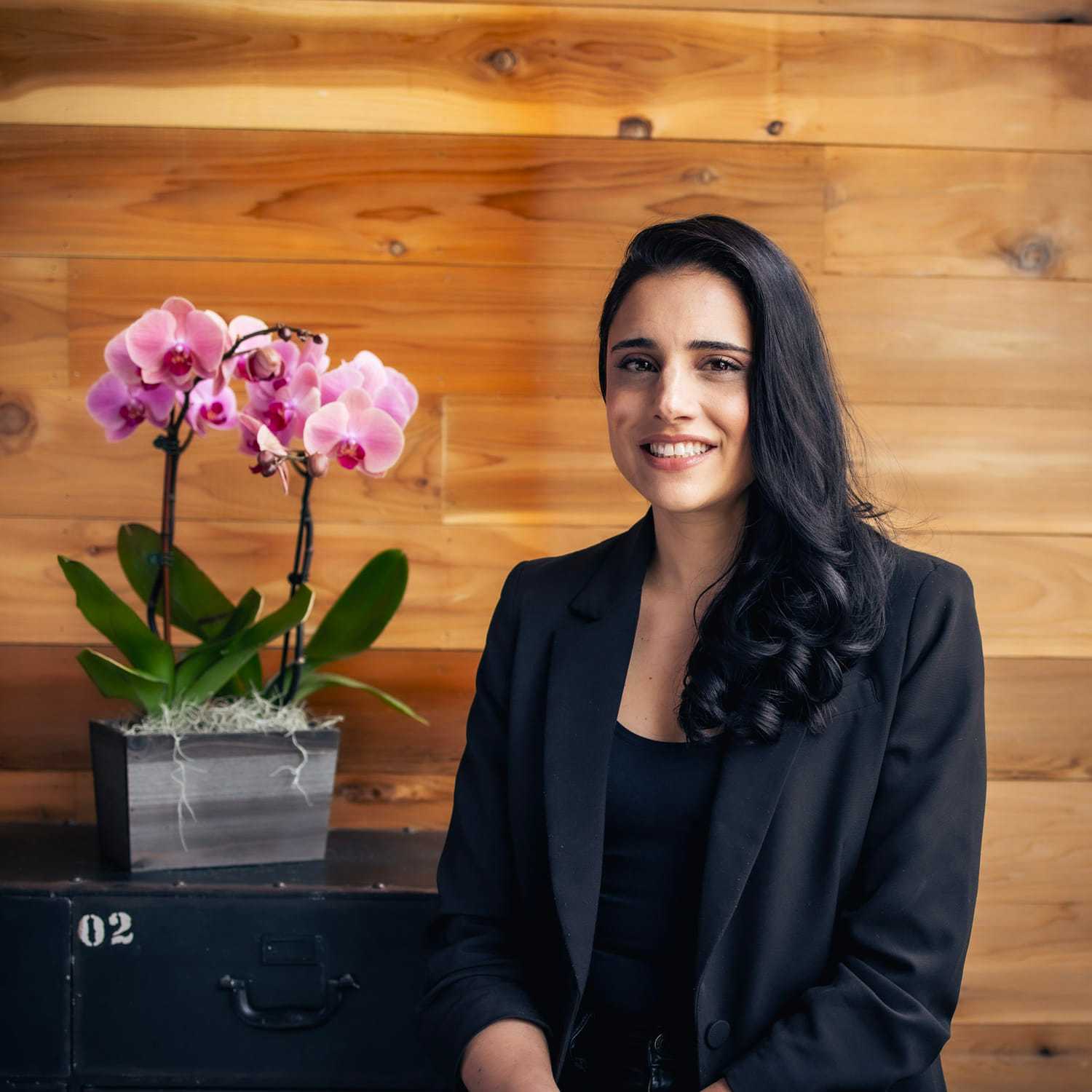 Portrait of Melissa, a professional stylist at Salon Paul Michael, showcasing their expertise and style.